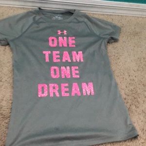 A hot pink and grey Under Armour shirt.